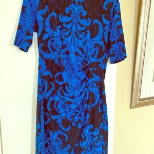 Blue and black color dress dress. Wrap look.